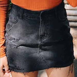 Destroyed black denim skirt